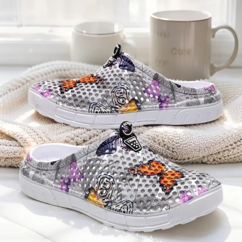 Step into a pastoral dream and bloom with sweet charm! Women's butterfly-printed clogs, with lightweight design and dreamy print